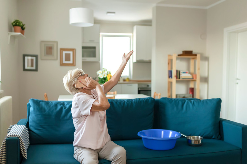 senior dealing with a plumbing problem